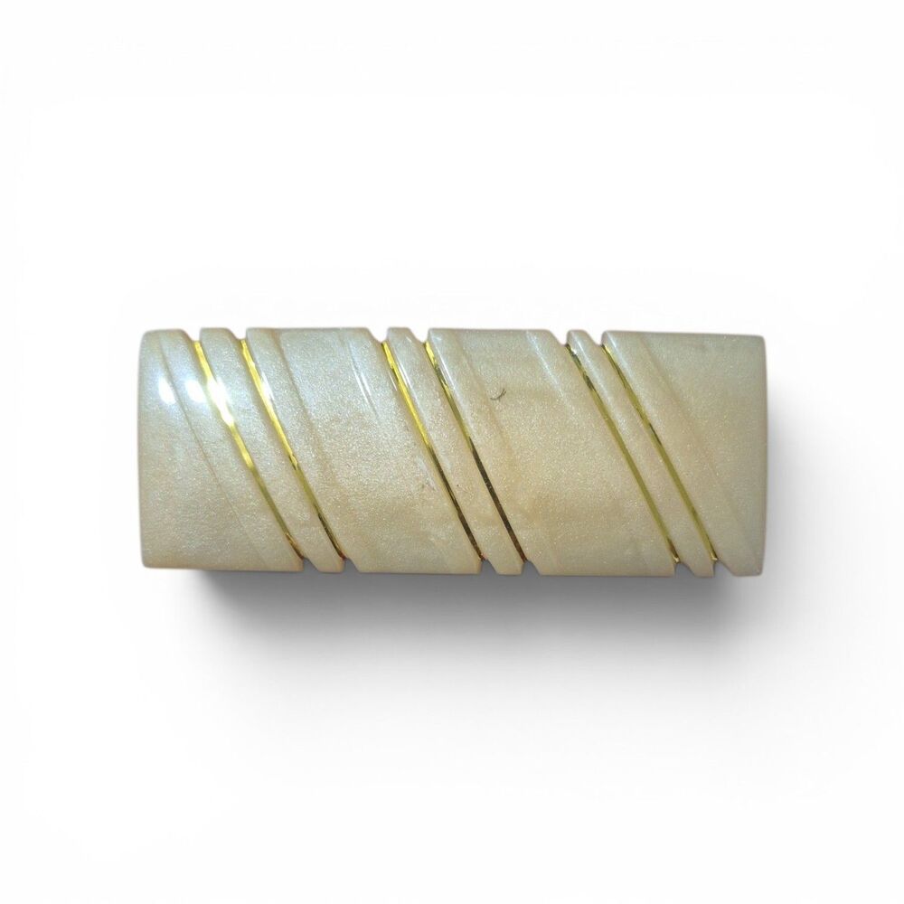 vintage 1980s hair barrette is made of cream-colored resin